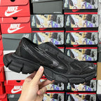 Balenciaga unisex sneakers front three-quarter view, black mesh upper and chunky sole