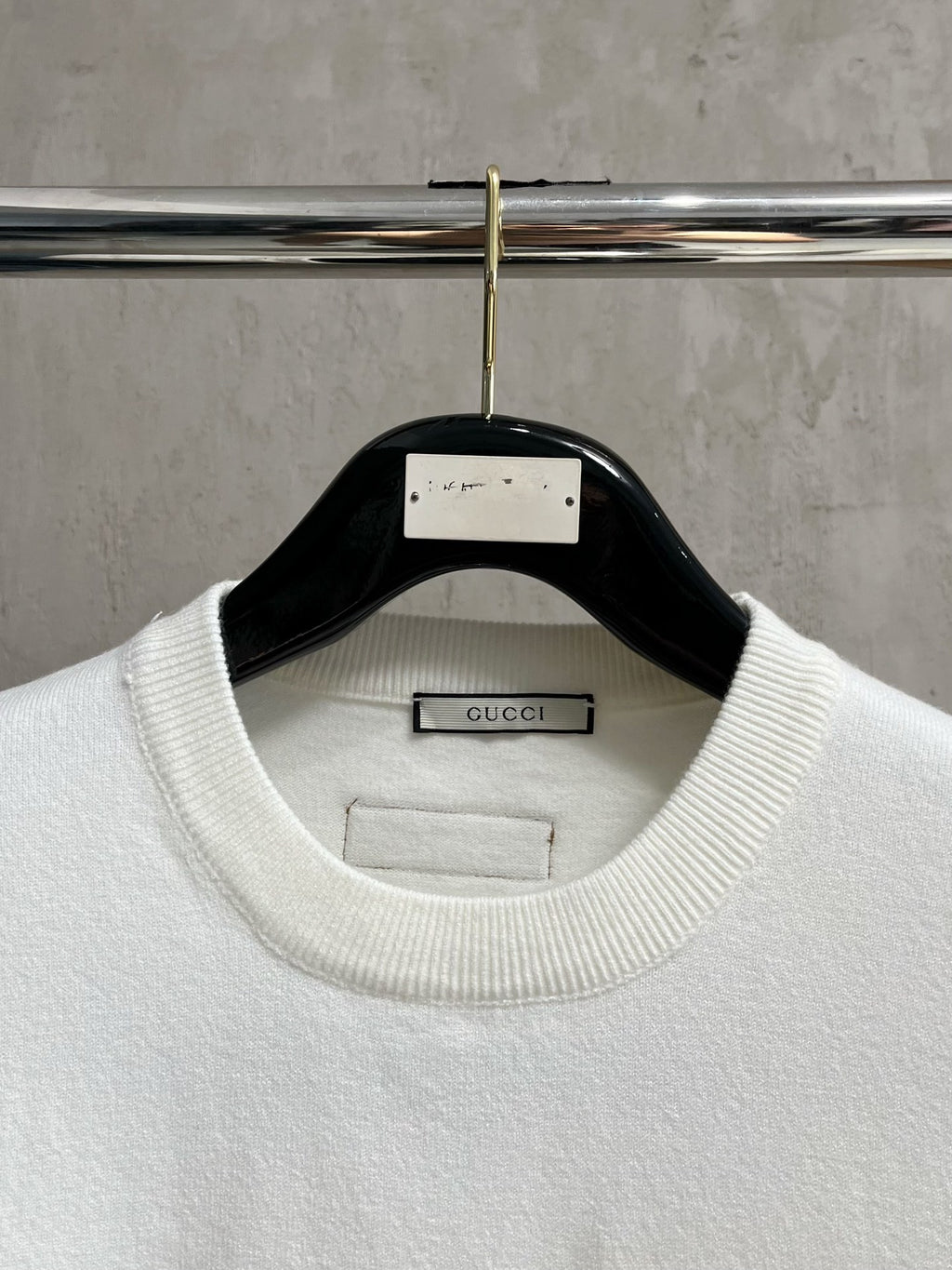 Gucci white crewneck sweater with ribbed collar and Gucci label inside neckline