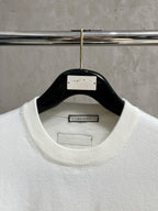 Gucci white crewneck sweater with ribbed collar and Gucci label inside neckline