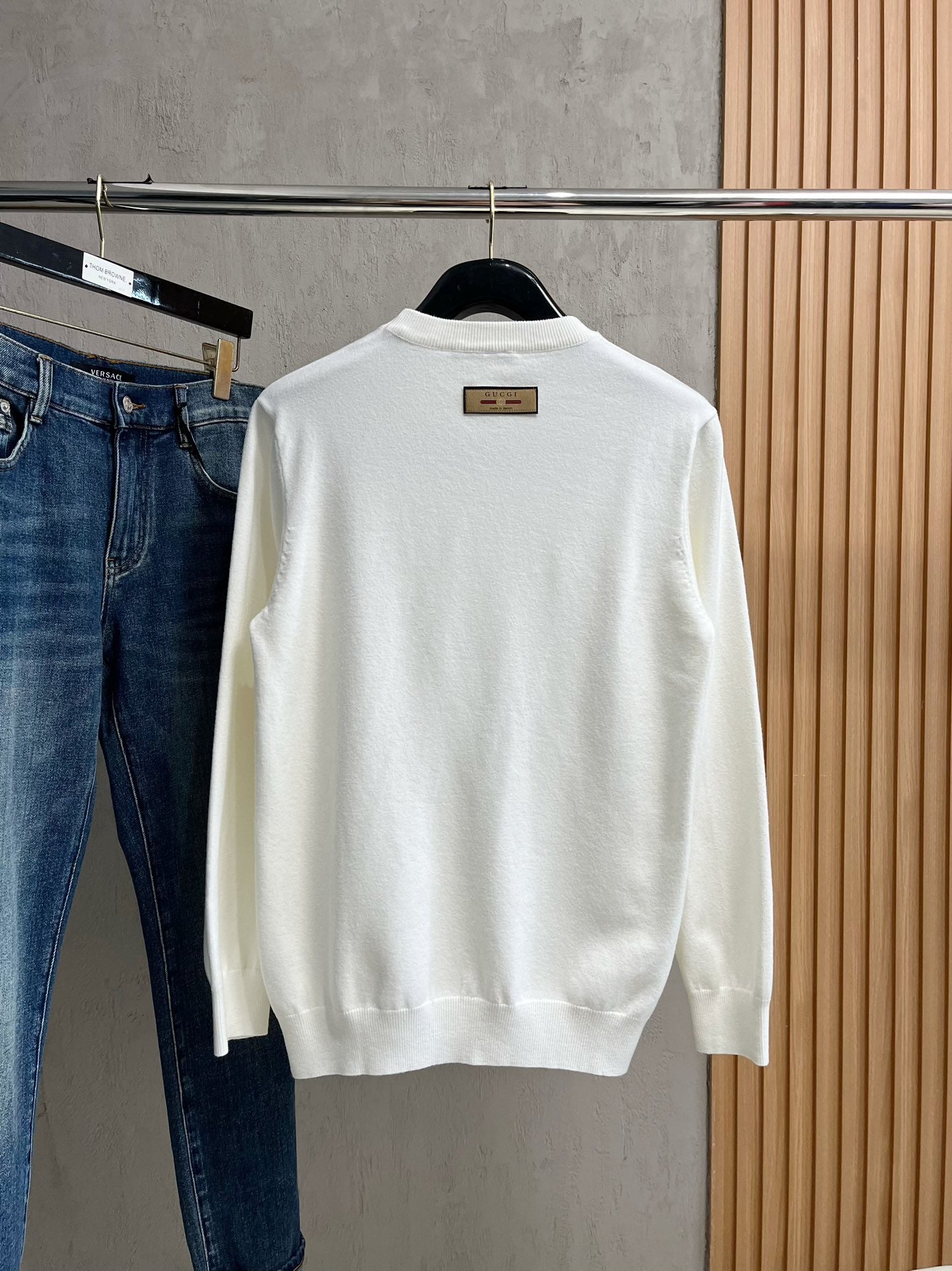 Gucci white crewneck sweater back view with small brown label