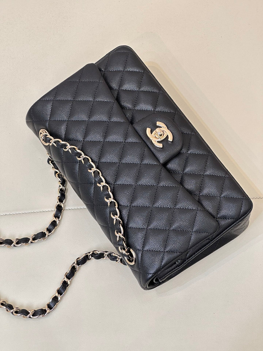 Chanel dark navy quilted shoulder bag with chain strap and CC logo front