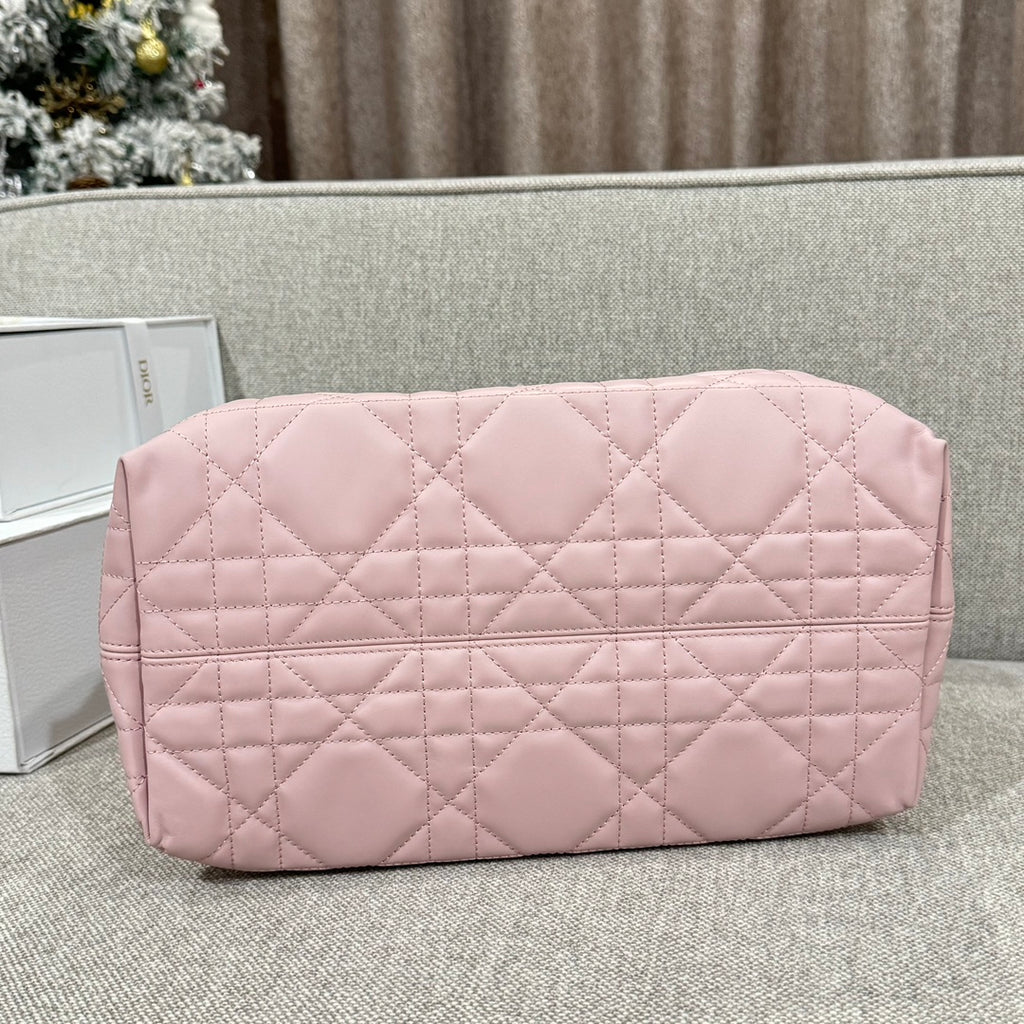 Pink quilted zip-top clutch bag with diamond pattern front