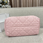Pink quilted zip-top clutch bag with diamond pattern front