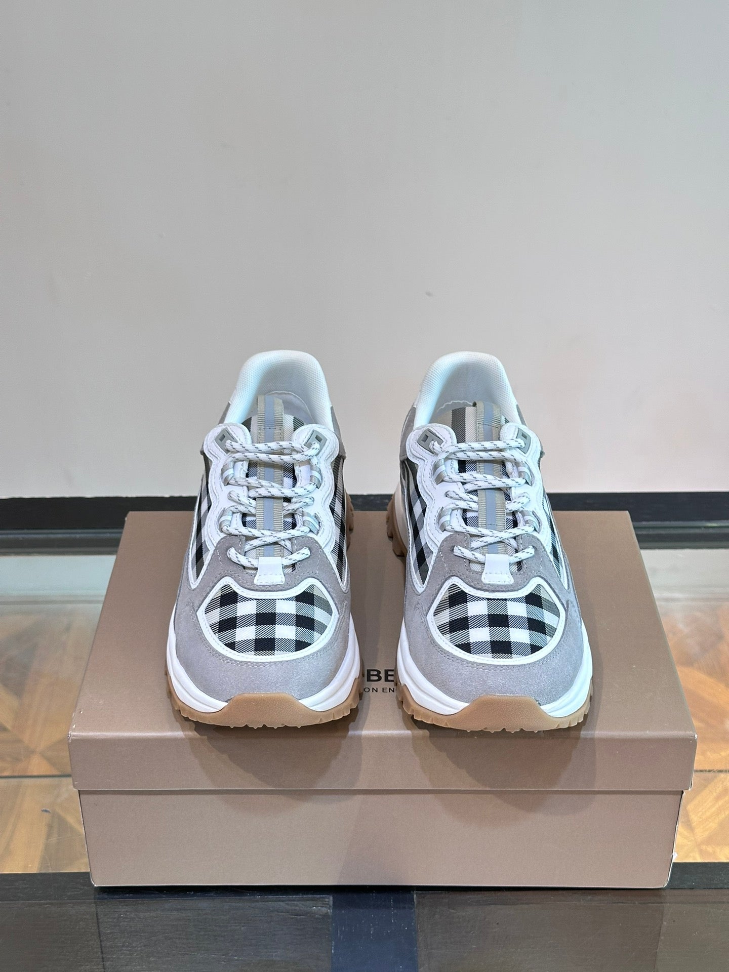 Burberry pair of grey lace-up sneakers with black-and-white check toe and sides, rubber sole