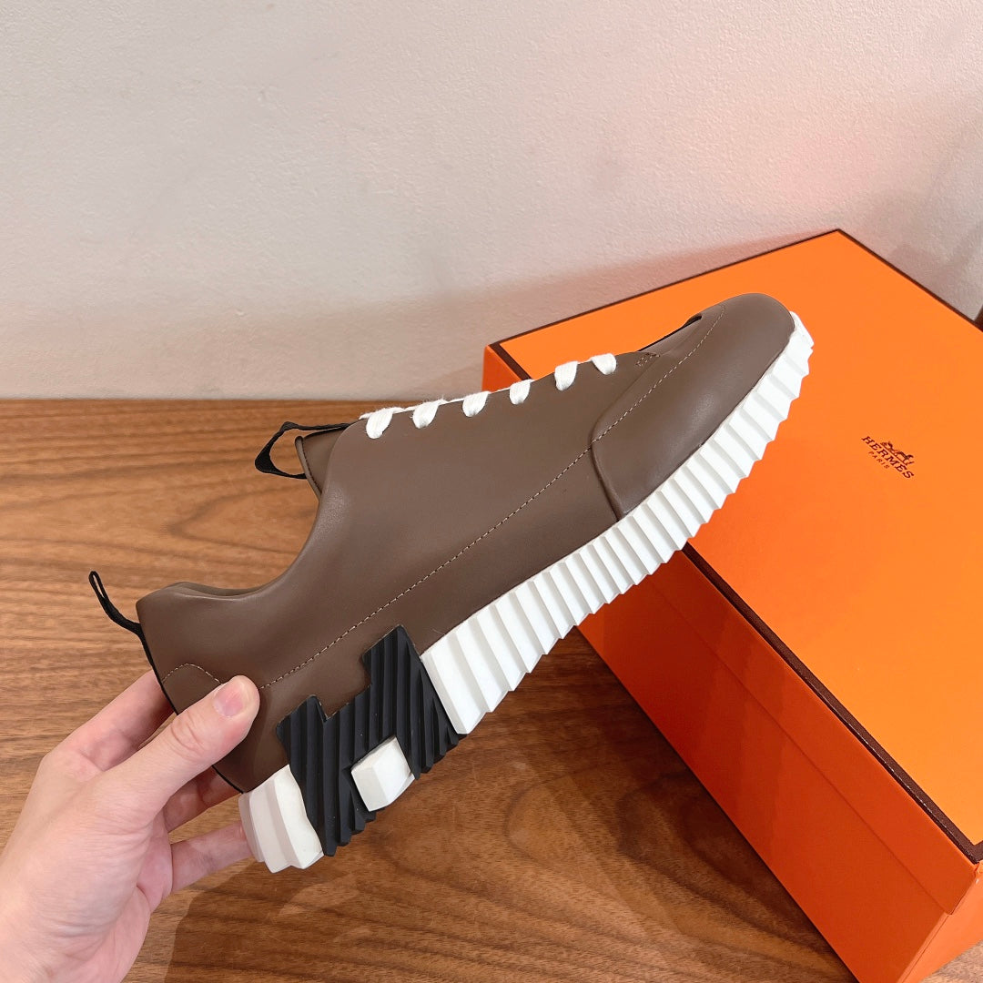 Hermes unisex sneakers, brown leather, side cutout detail, white ribbed sole, lace-up front