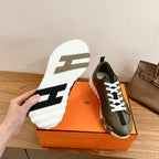 Olive leather sneaker outsole and side detail with white lugs and white laces