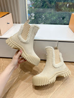 Louis Vuitton suede ankle boots, beige shearling-lined openings and ridged rubber sole