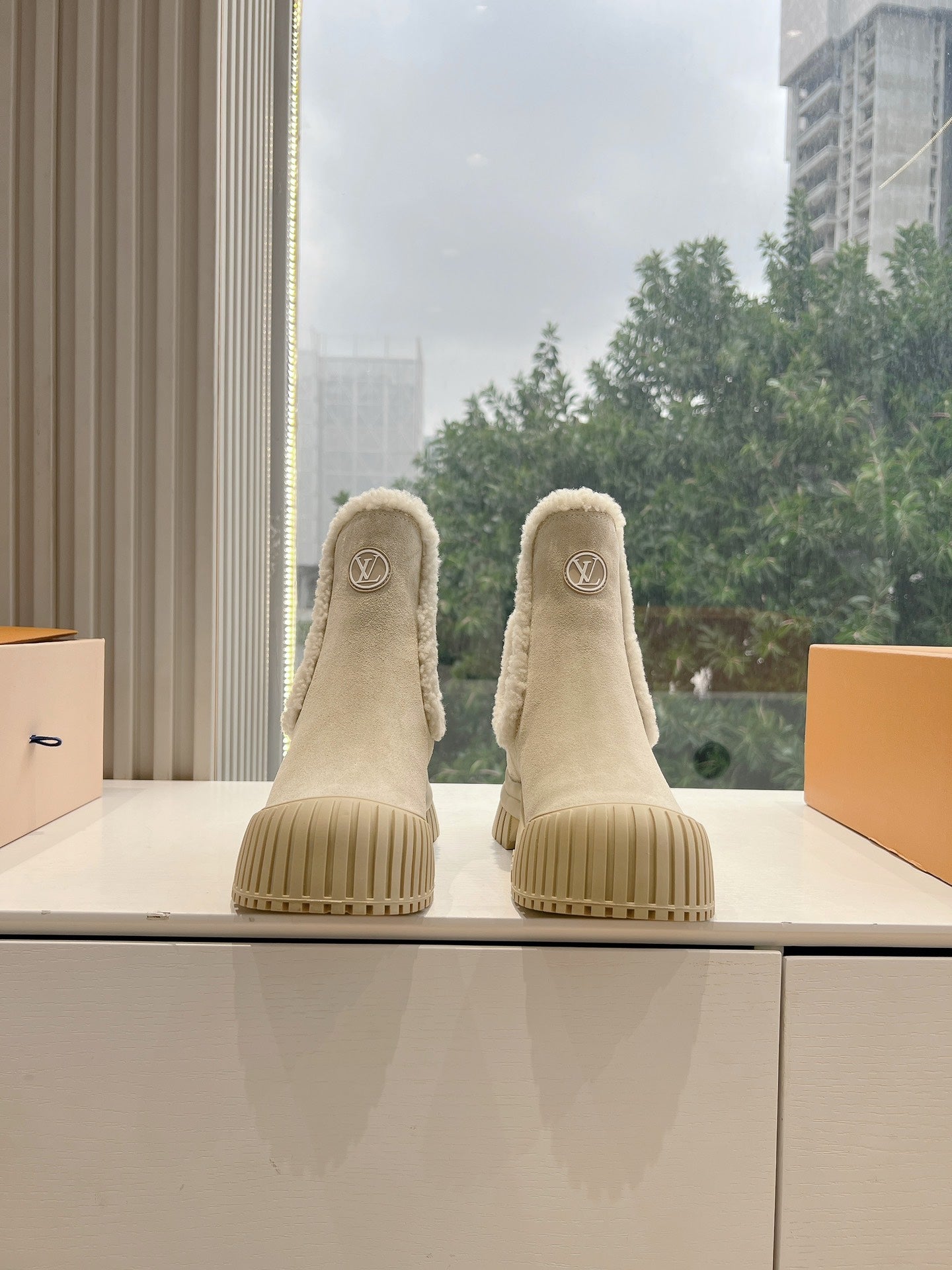 Louis Vuitton suede ankle boots, beige with shearling trim and ridged rubber sole