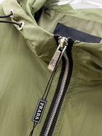 Prada hooded long jacket detail with metal zipper pull and PRADA tag