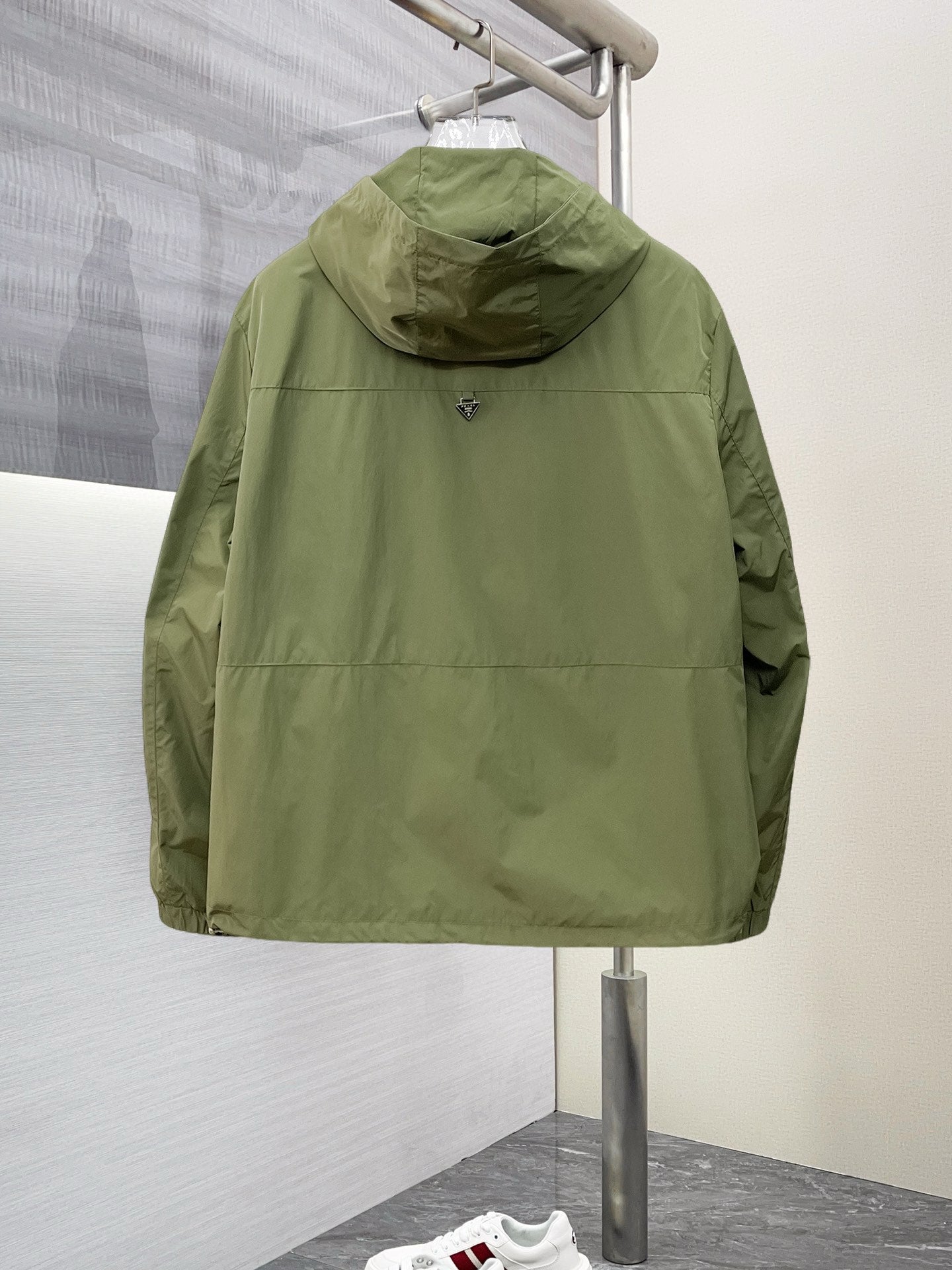 Prada hooded long jacket back view in olive green with full-zip front