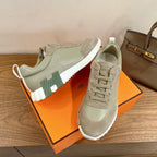 Hermes unisex sneakers, light suede with green accent panels, white cupsole