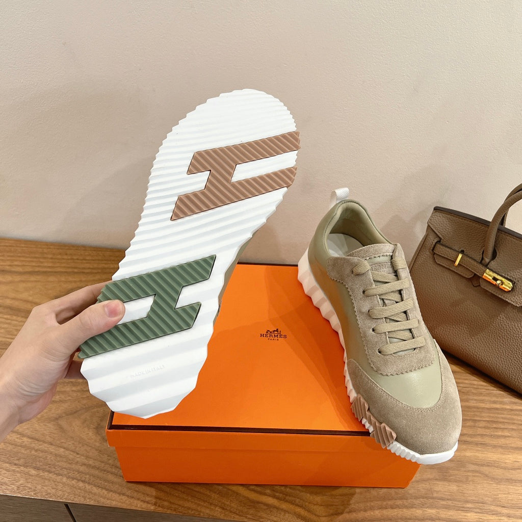 Hermes unisex sneakers, white outsole with light tread and green stripe detail