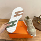 Hermes unisex sneakers, white outsole with light tread and green stripe detail