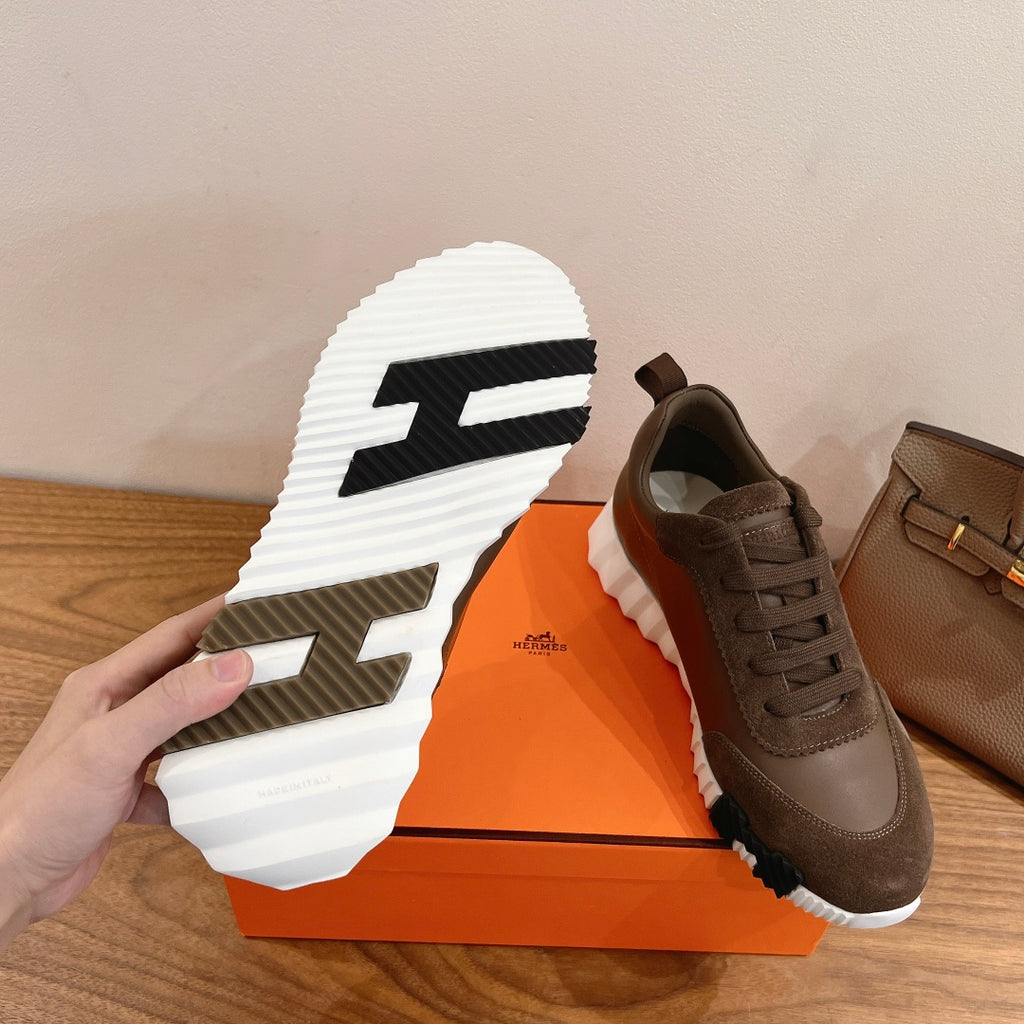 Hermes unisex sneaker outsole with white tread and taupe upper