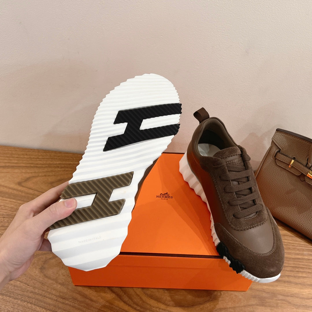 Hermes unisex sneaker outsole with white tread and taupe upper