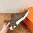 Hermes unisex sneakers in taupe with lace-up closure and white ribbed platform sole