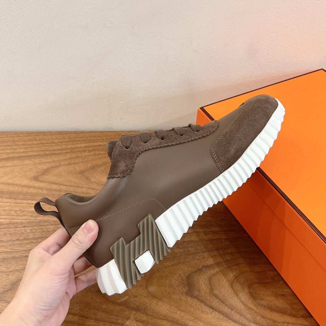 Hermes unisex sneakers in taupe with lace-up closure and white ribbed platform sole