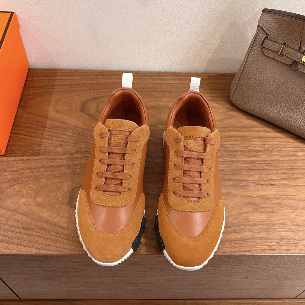 Tan lace-up sneakers with suede and leather panels, white rubber sole