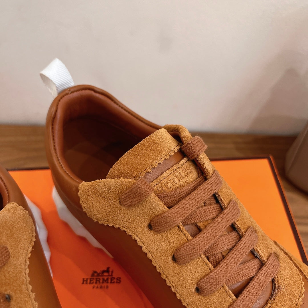 Tan suede and leather sneakers with lace-up front and padded collar
