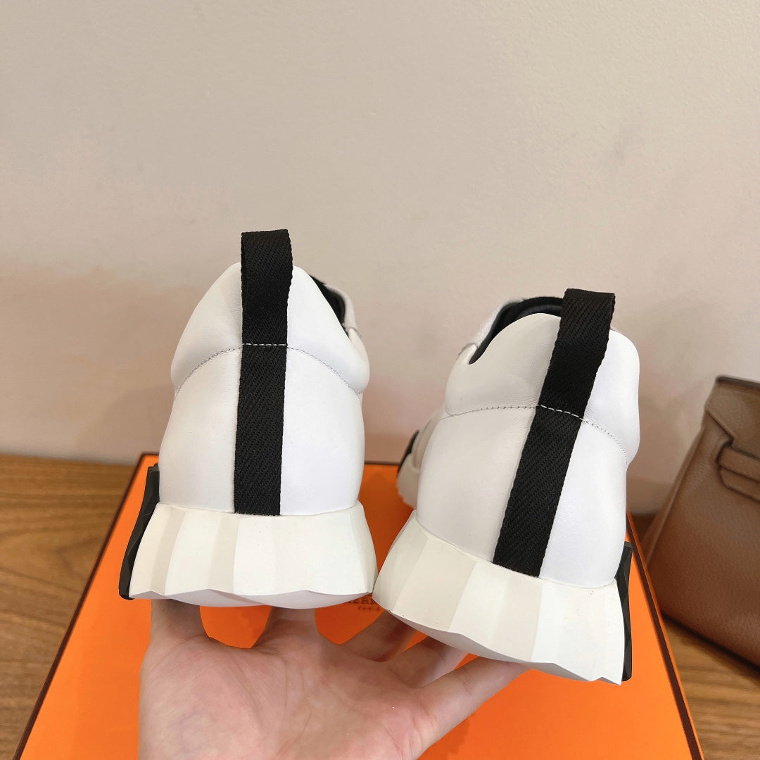 Unisex luxury sneakers, white back view with black vertical pull tabs