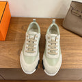 Unisex sneakers in pale green and off-white with lace-up front and white rubber sole