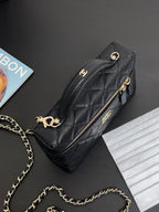 Chanel quilted crossbody bag with gold-tone hardware, front zipper, and chain strap