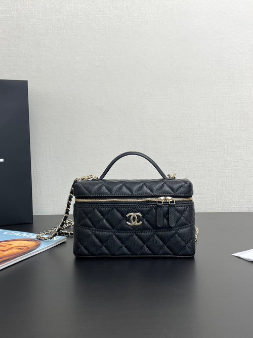 Chanel quilted top-handle bag in dark blue with gold-tone logo and zipper closure