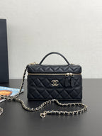 Chanel quilted shoulder bag with gold-tone logo, front zipper, and chain strap
