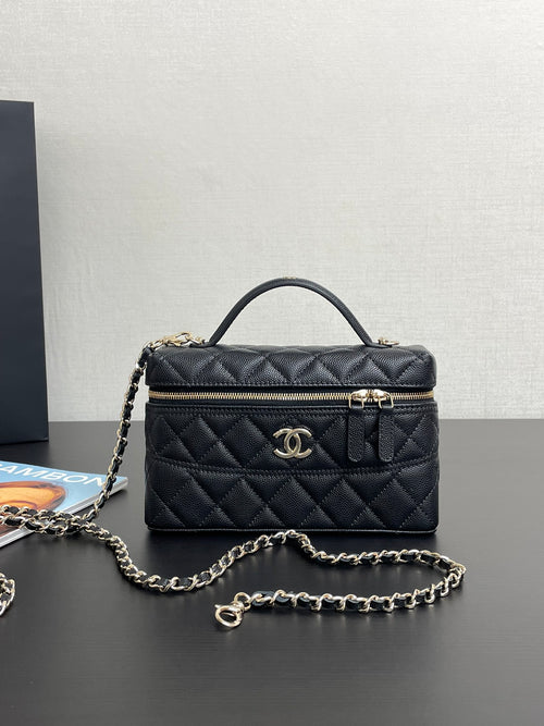 Chanel quilted shoulder bag with gold-tone logo, front zipper, and chain strap