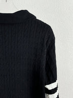 Dark navy ribbed knit back panel with white stripe detail on a quilted jacket