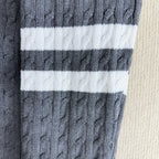 Moncler long knit sweater with white stripe panels, light blue cable knit texture