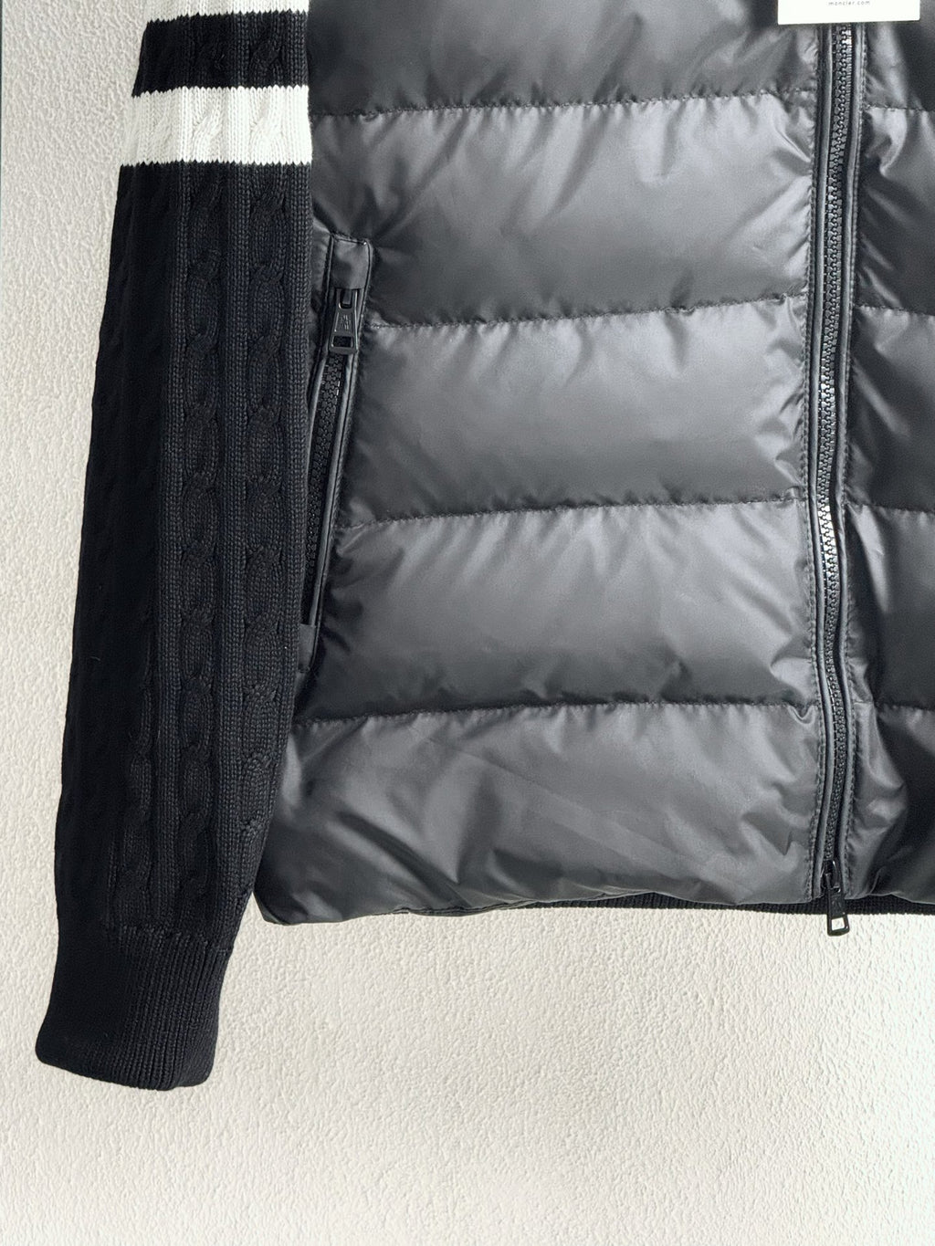 Long puffer jacket with front zipper and ribbed knit sleeves, striped cuffs