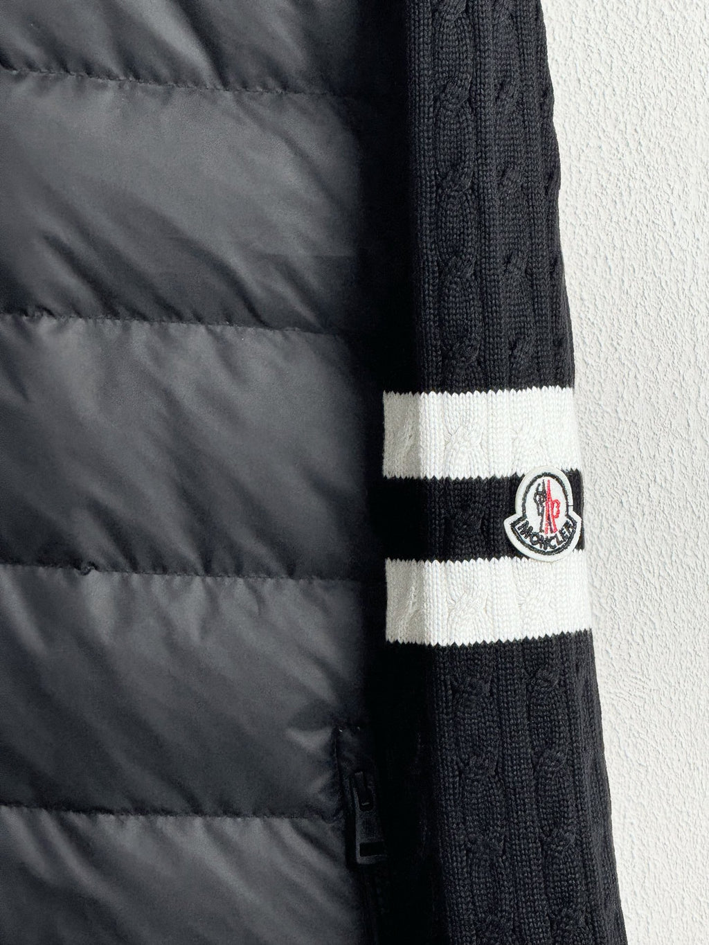 Long puffer jacket sleeve with ribbed knit cuff and striped band detail