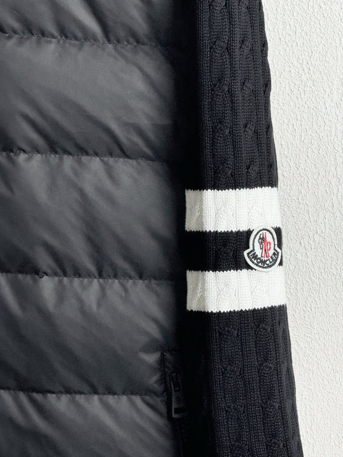Long puffer jacket sleeve with ribbed knit cuff and striped band detail