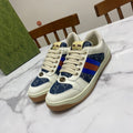 Gucci unisex low-top sneakers, white leather with blue patterned panels and multicolor web stripe