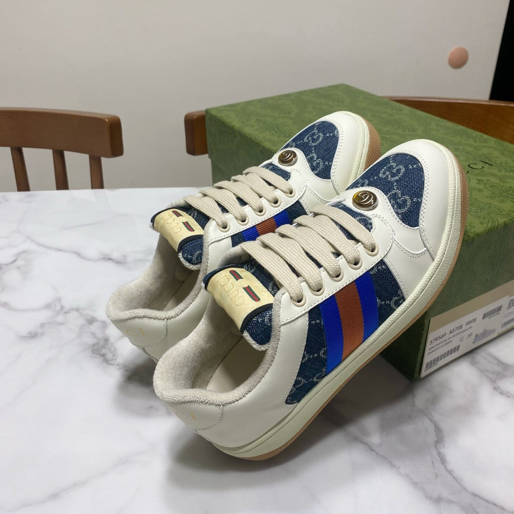Gucci unisex low-top sneakers with white laces and blue patterned toe, multicolor web stripe details