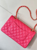 Fuchsia quilted leather mini bag with chain strap and diamond-pattern front flap