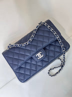 Quilted leather flap shoulder bag with chain strap, front view, dark navy blue.