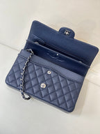 Quilted leather flap shoulder bag with chain strap, open view with top pocket, dark navy.