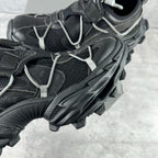 Balenciaga unisex sneaker detail, black mesh and leather panels with silver lace trim
