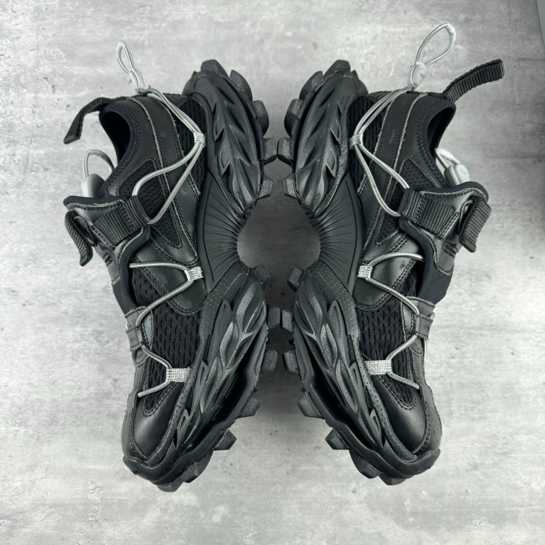 Balenciaga unisex sneakers front view, black lace-up design with chunky trail sole