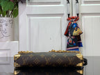 Louis Vuitton monogram handbag with gold hardware and chain strap details