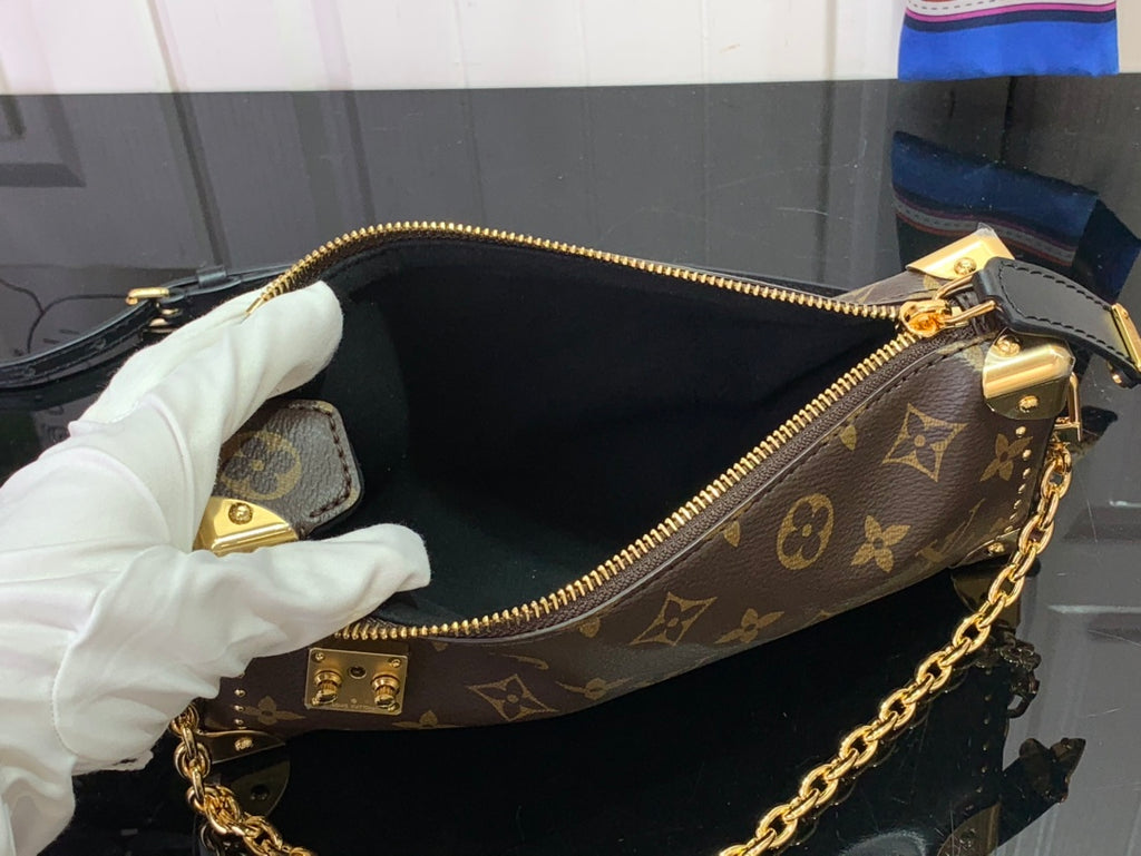 Louis Vuitton monogram bag interior with zip closure and black lining