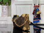 Louis Vuitton monogram mini handbag with gold studs, top handle, and shoulder strap
