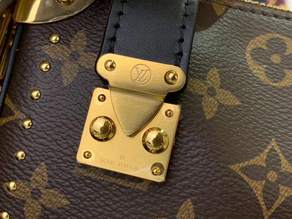 Louis Vuitton monogram flap closure with gold lock plate and rivets