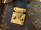 Louis Vuitton monogram flap closure with gold lock plate and rivets