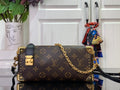 Louis Vuitton monogram crossbody bag with gold chain strap and dark leather trim