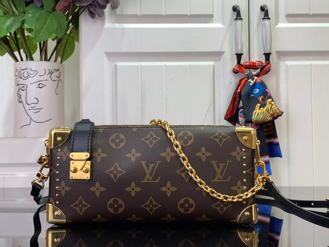 Louis Vuitton monogram crossbody bag with gold chain strap and dark leather trim
