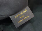 Louis Vuitton Paris made in France authenticity tag on gray fabric backing