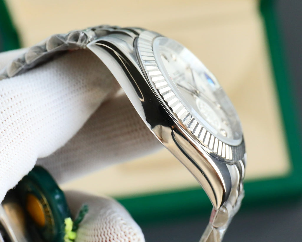 Stainless steel Rolex wristwatch side profile with ridged bezel